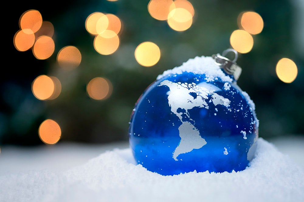 Ornament that looks like the world in a pile of snow