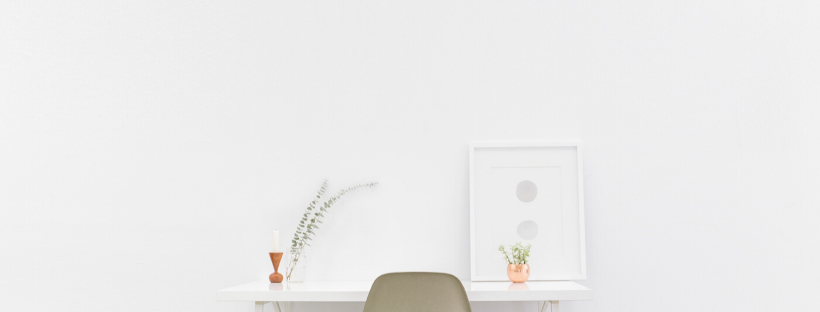 white desk at a white wall