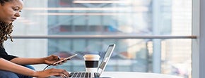 woman on phone and computer