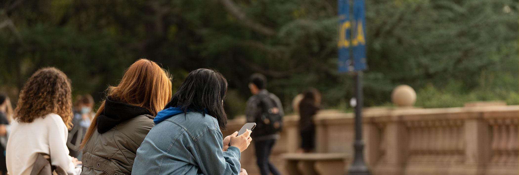 UCLA students using their smartphones 